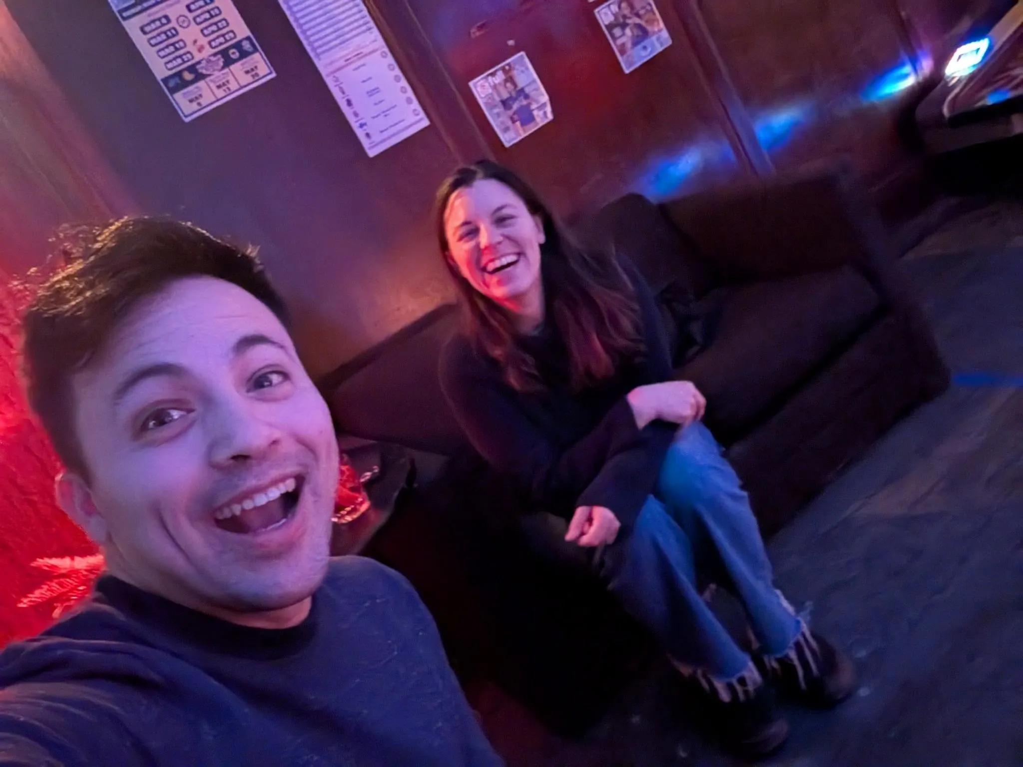 Eric and Maya hanging out at a dive bar